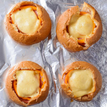 Buns with tomato and cheese baked in the ovenの写真素材