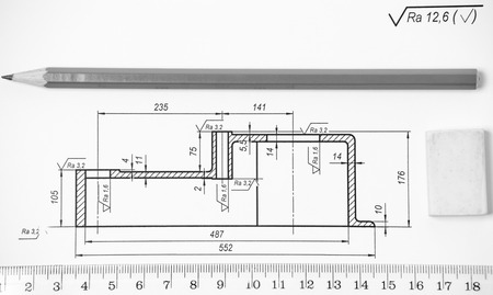 Measuring and drawing instruments and drawings on the tableの写真素材