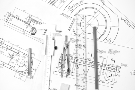 Measuring and drawing instruments and drawings on the tableの写真素材