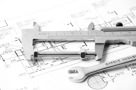 Measuring and drawing instruments and drawings on the tableの写真素材