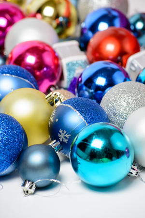 Christmas tinsel and balls on a white backgroundの写真素材