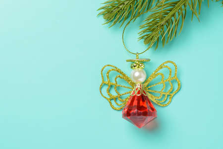 Toys and spruce branches on a turquoise backgroundの写真素材