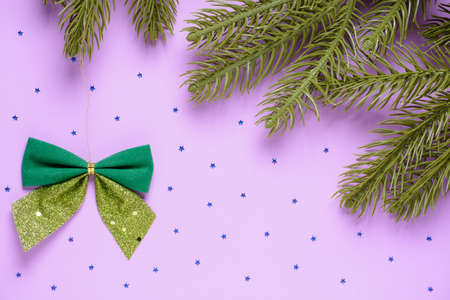 Bows and fir branches on a pink backgroundの写真素材