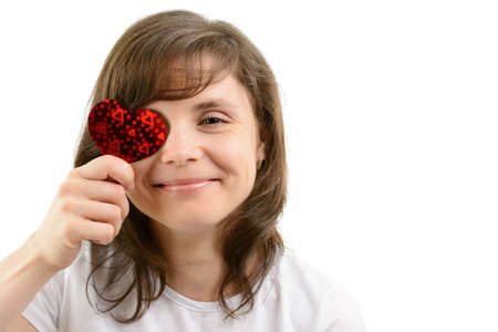 Young woman and paper hearts on a white backgroundの写真素材