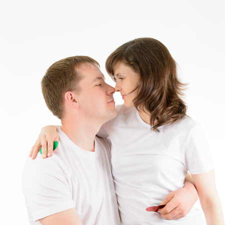 Love couple tenderly embracing on a white backgroundの写真素材