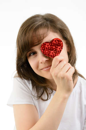 Young woman and paper hearts on a white backgroundの写真素材