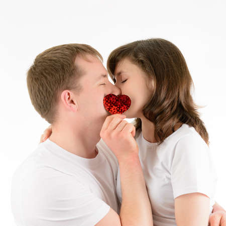 Love couple tenderly embracing on a white backgroundの写真素材