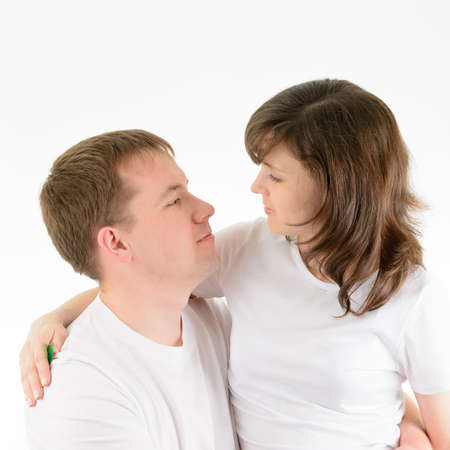 Love couple tenderly embracing on a white backgroundの写真素材