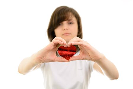 Young woman and paper hearts on a white backgroundの写真素材