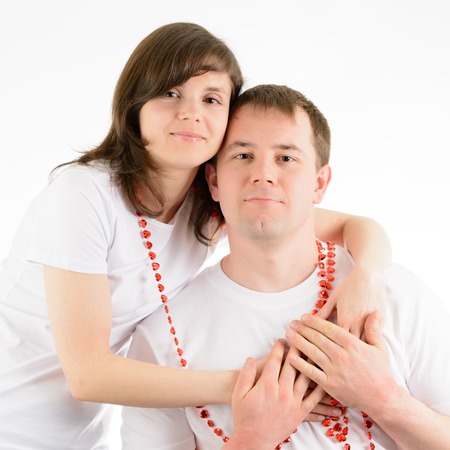 Love couple tenderly embracing on a white backgroundの写真素材