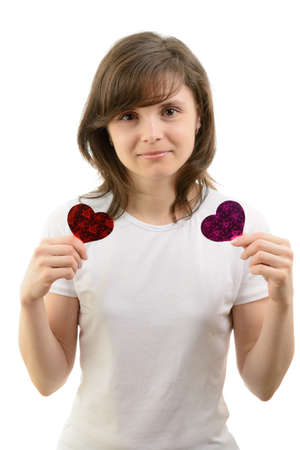 Young woman and paper hearts on a white backgroundの写真素材