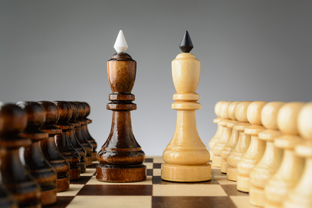 Black king standing next to white on the chessboardの写真素材