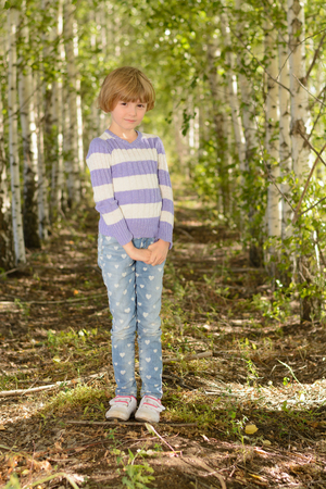 The girl with white hair in the spring in a birch groveの写真素材