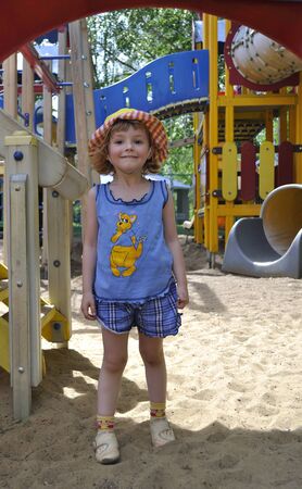 Little girl in panama playing on playgroundの写真素材