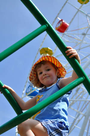 Little girl in panama playing on playgroundの写真素材
