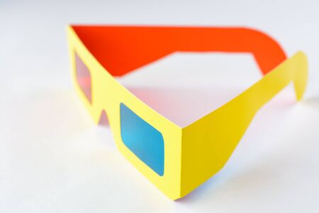 3D Glasses in a yellow frame on a white pedestalの写真素材