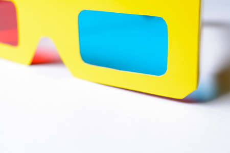 3D Glasses in a yellow frame on a white pedestalの写真素材