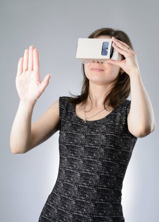 Young woman playing a virtual reality glassesの写真素材