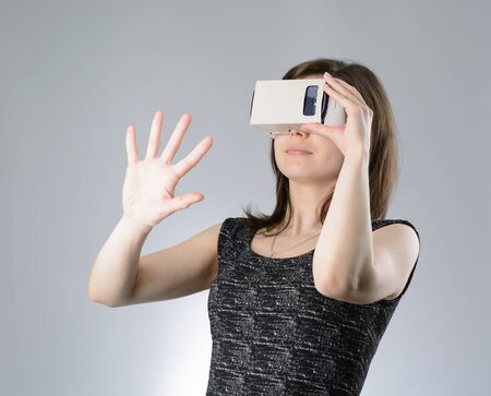 Young woman playing a virtual reality glassesの写真素材