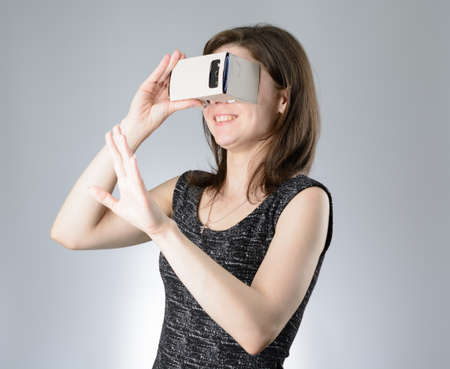 Young woman playing a virtual reality glassesの写真素材