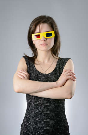 A young Woman black dress in 3d glassesの写真素材