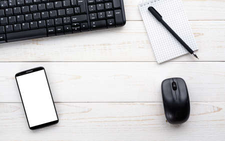 Top view of a white wooden office deskの写真素材