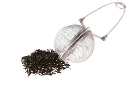 Leaf tea and strainer on white backgroundの写真素材