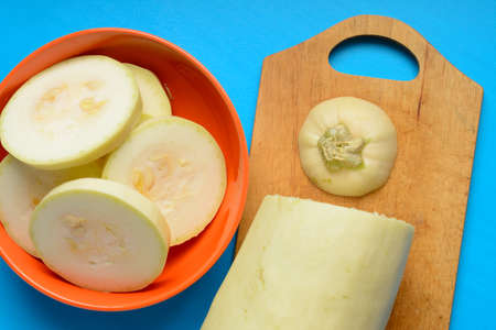Chopped fresh courgette on a blue backgroundの写真素材