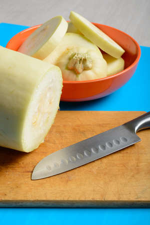 Chopped fresh courgette on a blue backgroundの写真素材