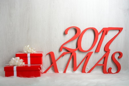 Number 2017 and Christmas gifts on a white carpet from furの写真素材