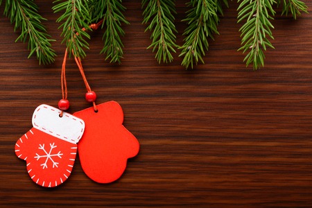 Christmas decorations and fir branch on a wooden backgroundの写真素材
