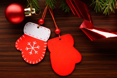 Christmas decorations and fir branch on a wooden backgroundの写真素材