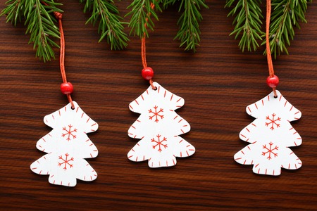 Christmas decorations and fir branch on a wooden backgroundの写真素材