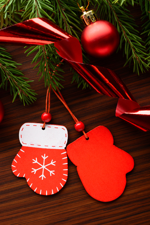 Christmas decorations and fir branch on a wooden backgroundの写真素材