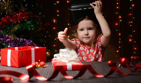 The girl received a Christmas present of virtual reality glassesの写真素材