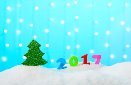 Christmas decoration tree and the numbers 2017 in the snowの写真素材