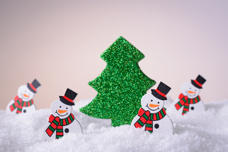 Christmas ornament snowmen, Christmas tree in the snowの写真素材