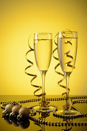 Two glasses of champagne and New Year decorationsの写真素材