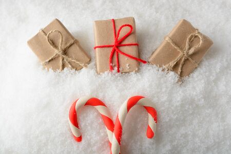 Three boxes with gifts on white snowの写真素材