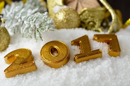 New year decorations lying on the white snow