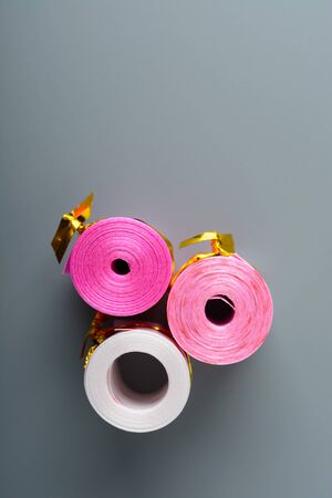 Decorative ribbon for decorating a box with a gift on a gray backgroundの写真素材