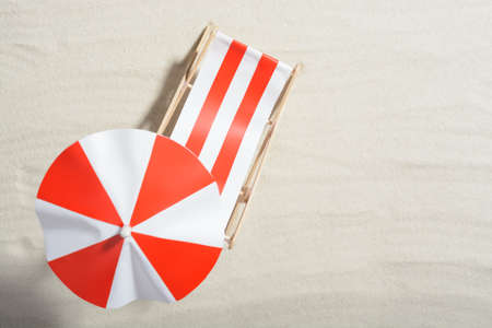 Red and white sunbed on the beach: top viewの写真素材