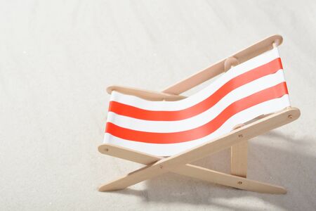 Red and white sunbed on the beach: top viewの写真素材
