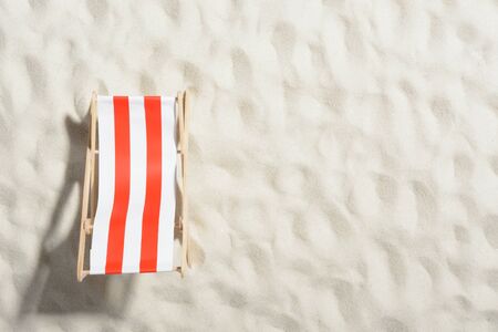 Red and white sunbed on the beach: top viewの写真素材