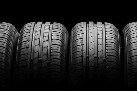 Car tires on black backgroundの写真素材