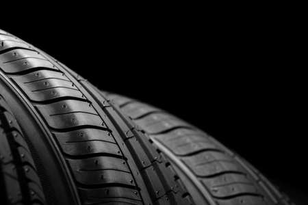 Car tires on black background
