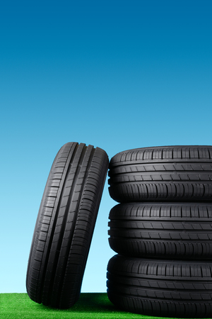 Summer car tyres on grassの写真素材