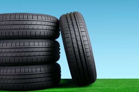 Summer car tyres on grassの写真素材