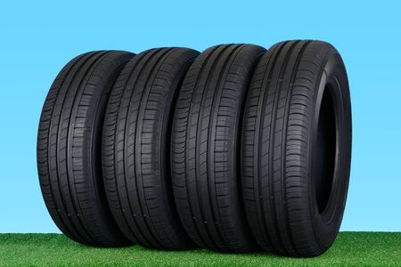 Summer car tyres on grassの写真素材