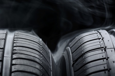 Car tires and smoke on black backgroundの写真素材